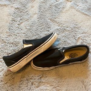 worn black slip on vans